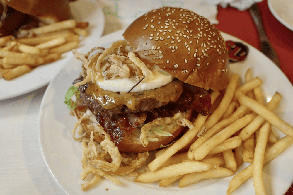 Hamburger at S&L's Diner with soft bun, delicious and juicy beef, fresh vegetables and cheese (Source: S&L's Diner)